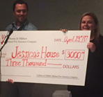 UH donating cheque to Jessica's house