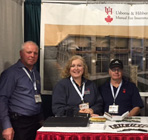 UH Staff at booth for poultry show