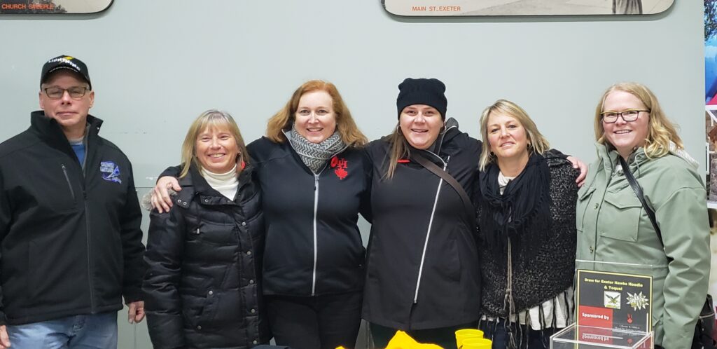 Usborne and Hibbert staff at hawks game